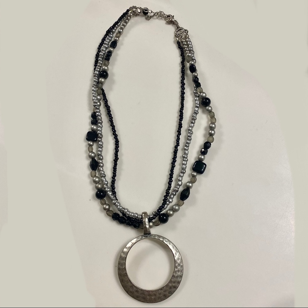 Three strand necklace with removable pendant